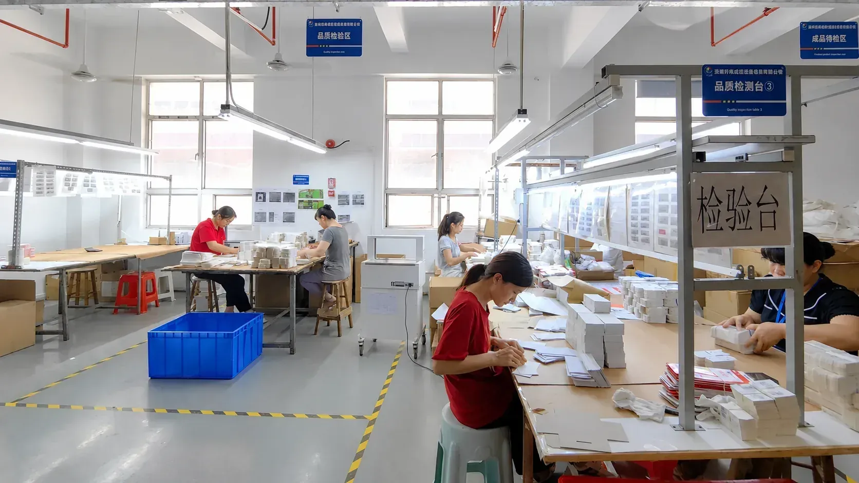 VVB Packaging quality control team inspecting custom paper packaging